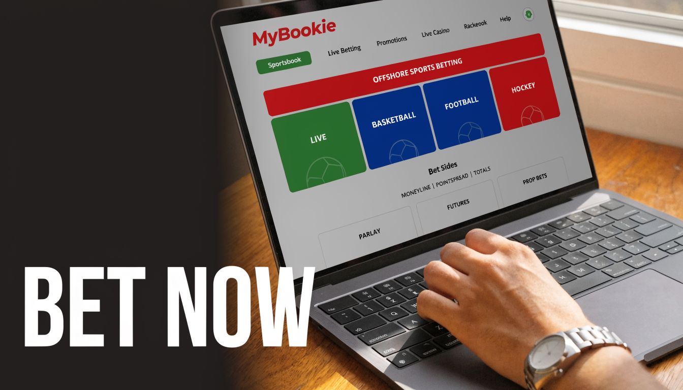 A person using a laptop to access the MyBookie online sportsbook website for placing sports bets.