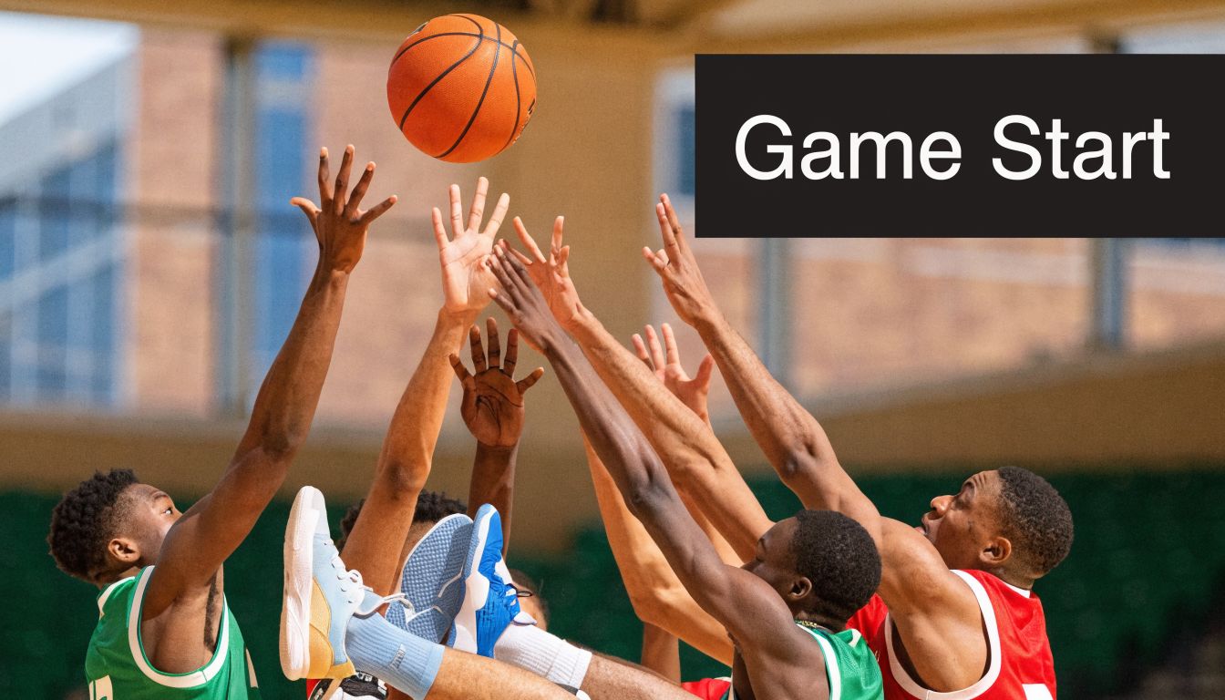Several basketball players reaching high to jump for the tip-off ball at the start of a game.