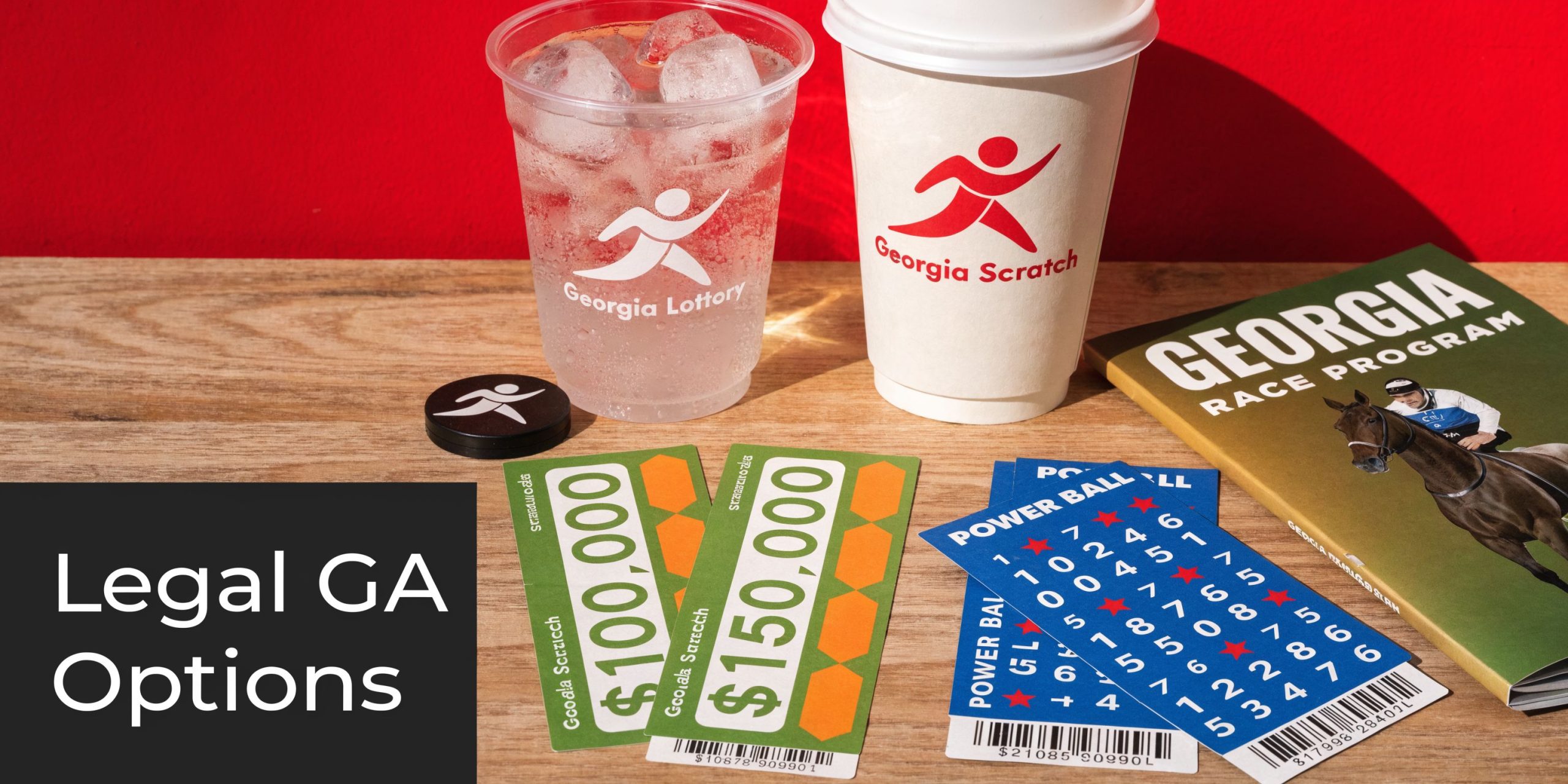 A collection of Georgia lottery scratch-off tickets, a race program, and drinks on a wooden table.