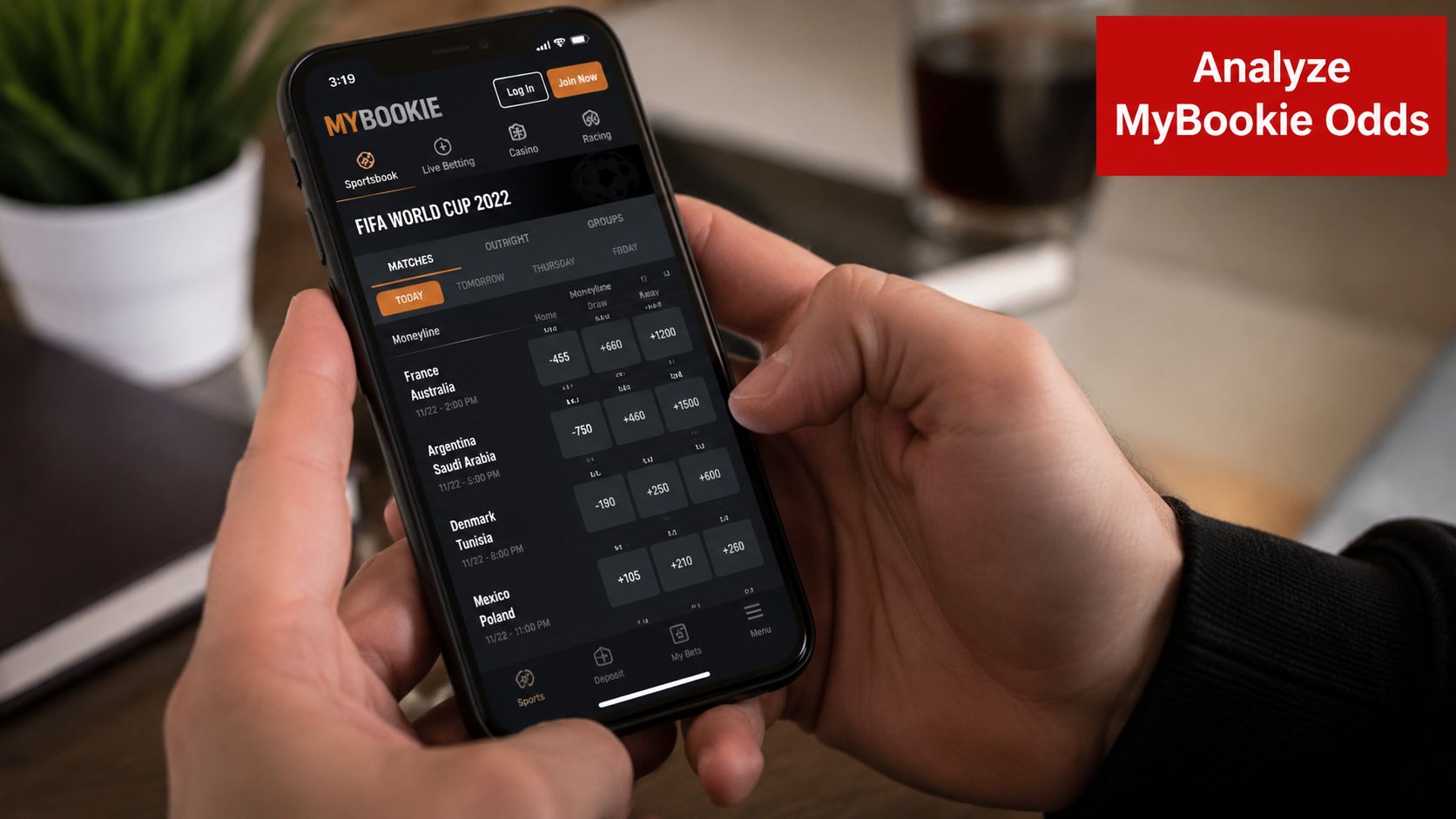 World Cup Betting Odds: A Complete 2026 Bettor's Guide 2 A person holding a smartphone showing FIFA World Cup 2022 betting odds on the MyBookie mobile application.